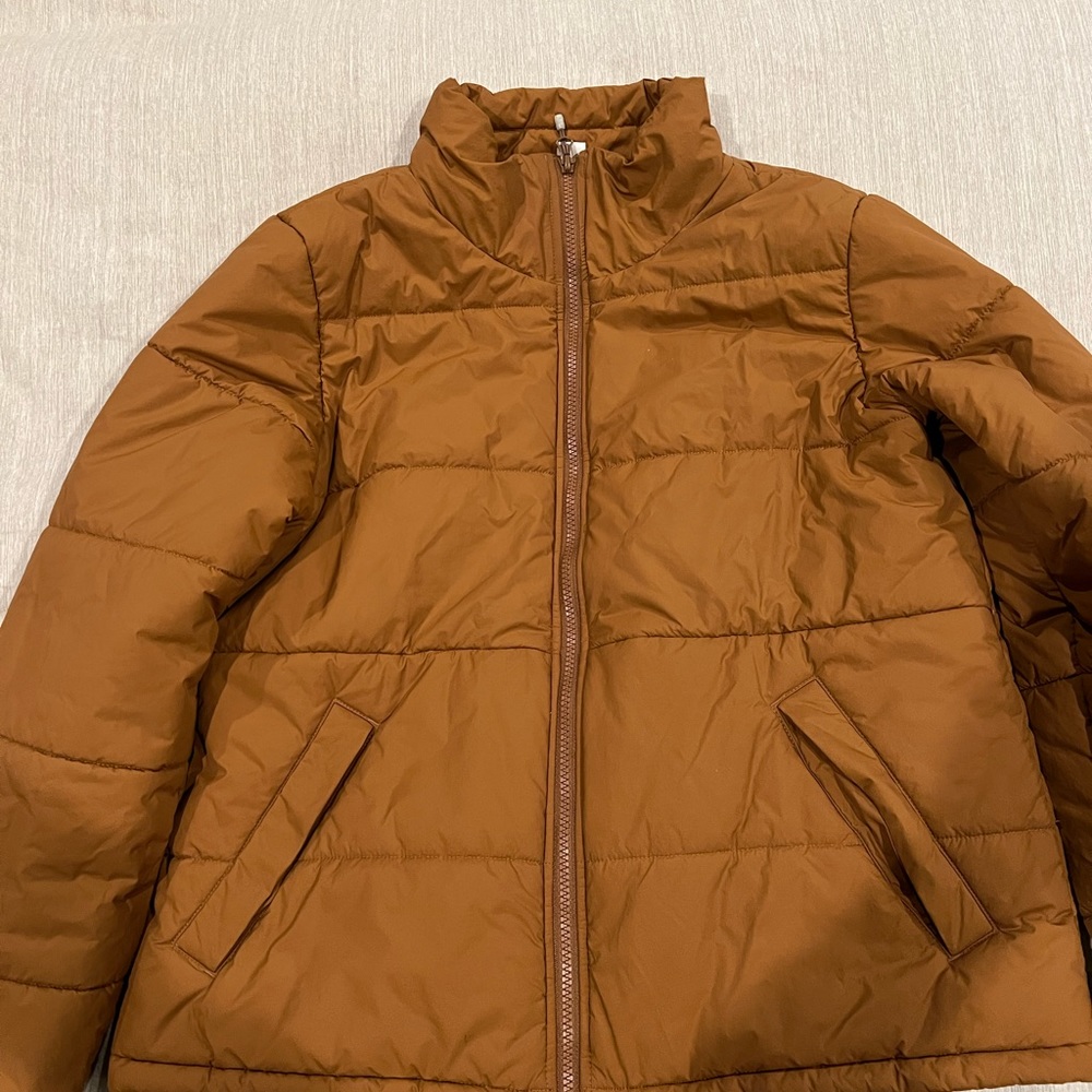REI Co-op waist length winter coat.